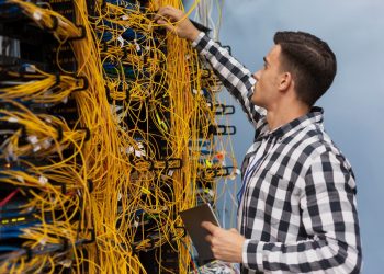 young-network-engineer-working-server-room_23-2148323441-1